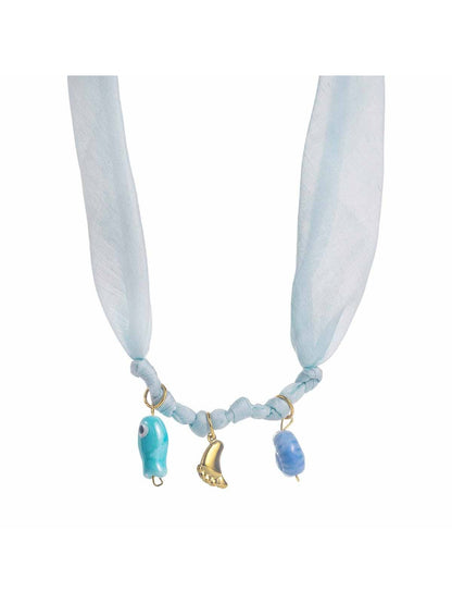Side view of Neckit Summer Charm fabric necklace highlighting fabric texture and charms