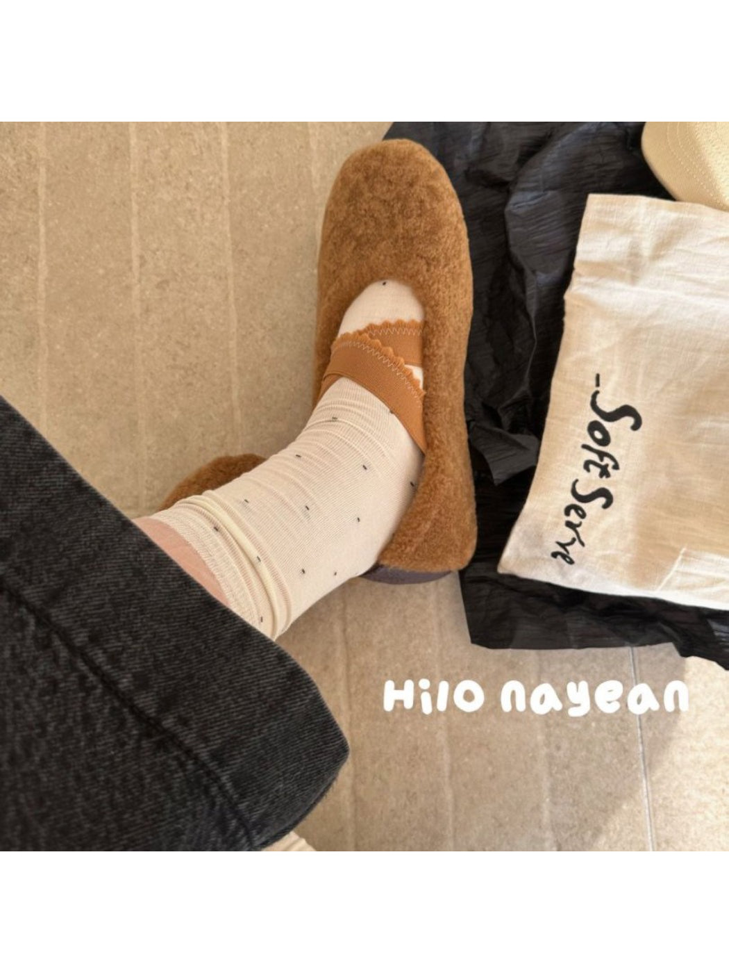 Model wearing Rufia soft polka mesh socks with a skirt and loafers