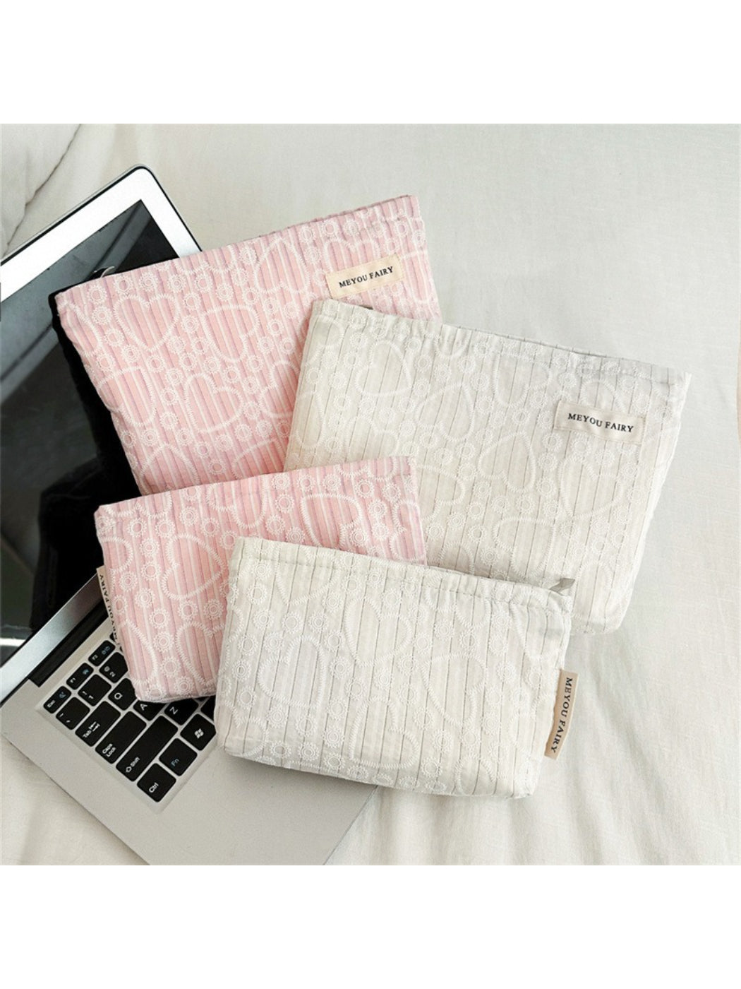 Cosbai heart pattern cosmetic bag shown with matching accessories