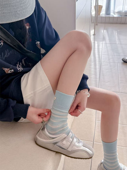 Rufia Stripe Heart mid-calf socks worn with shoes highlighting striped heart design