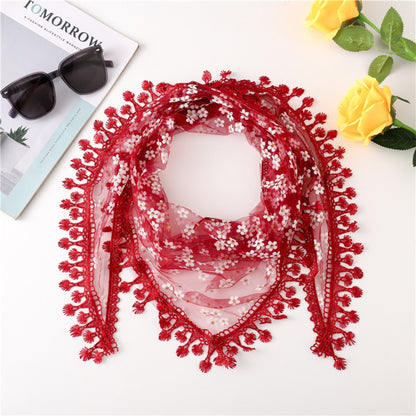 Model styling Haila Daisy Lace Triangle Veil Scarf as a neck scarf with floral lace pattern