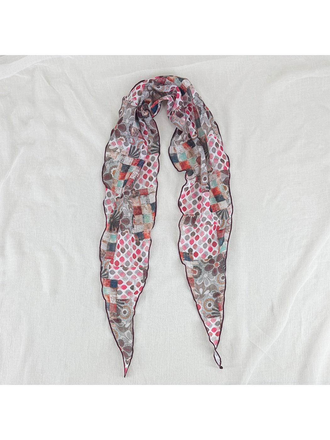 Model wearing Scarvii vintage patchwork skinny scarf styled with casual outfit