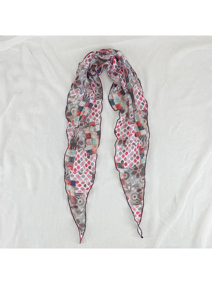 Model wearing Scarvii vintage patchwork skinny scarf styled with casual outfit