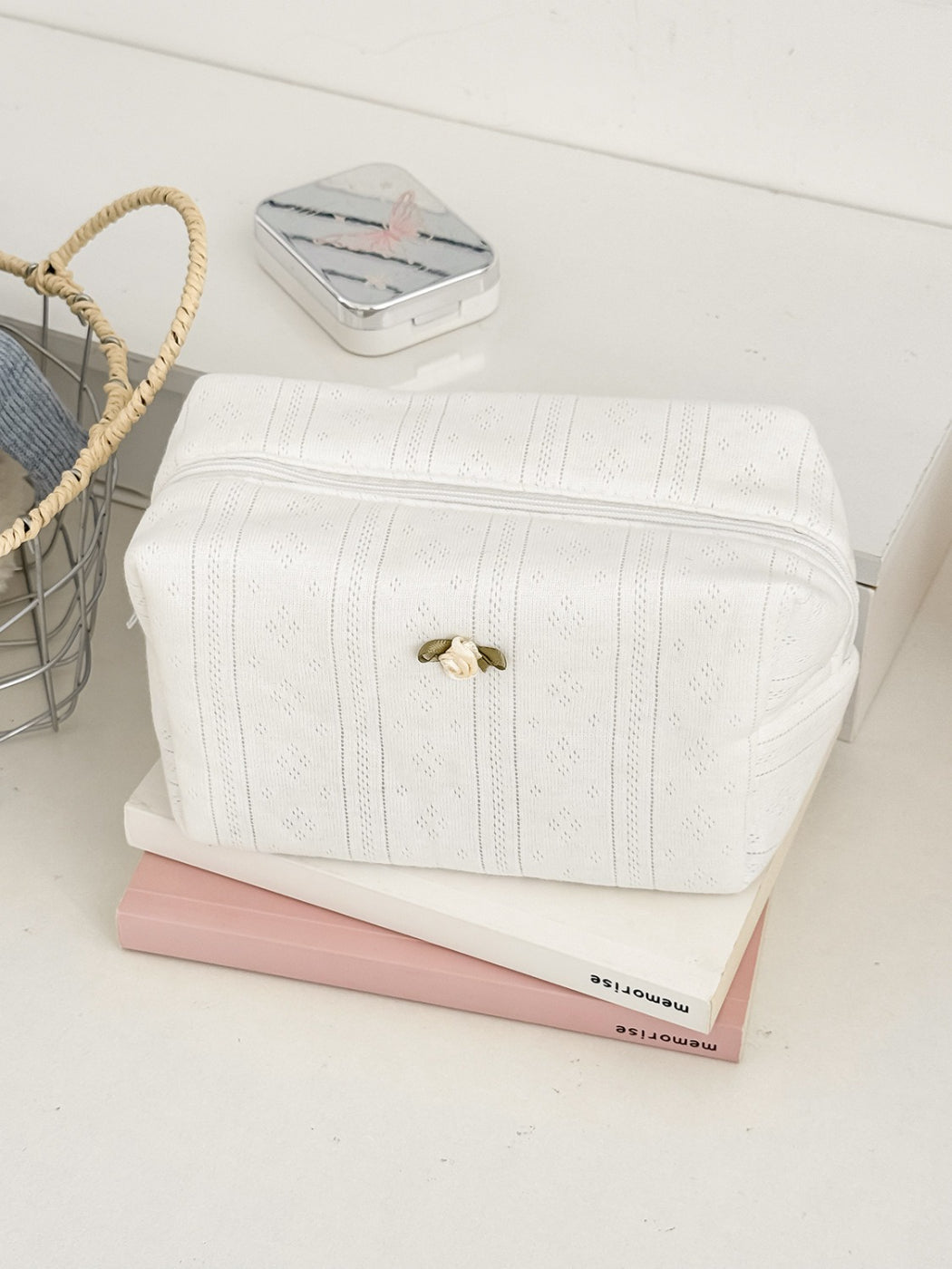 Close-up of rose detail embroidery on Cosbai cosmetic pouch