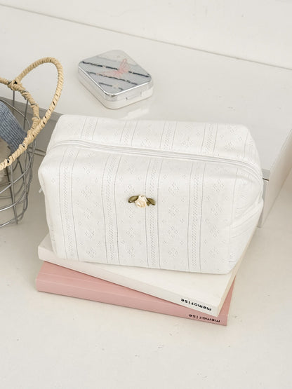 Close-up of rose detail embroidery on Cosbai cosmetic pouch