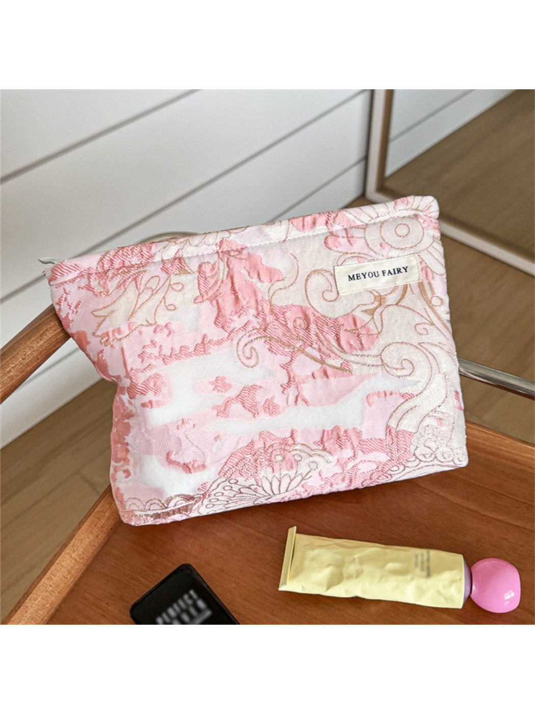 Close-up of Cosbai pink floral cosmetic bag showing detailed floral design