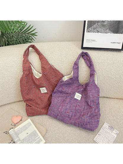 Side angle of Cosbai Soft Check Everyday Shoulder Tote Bag showing shoulder strap