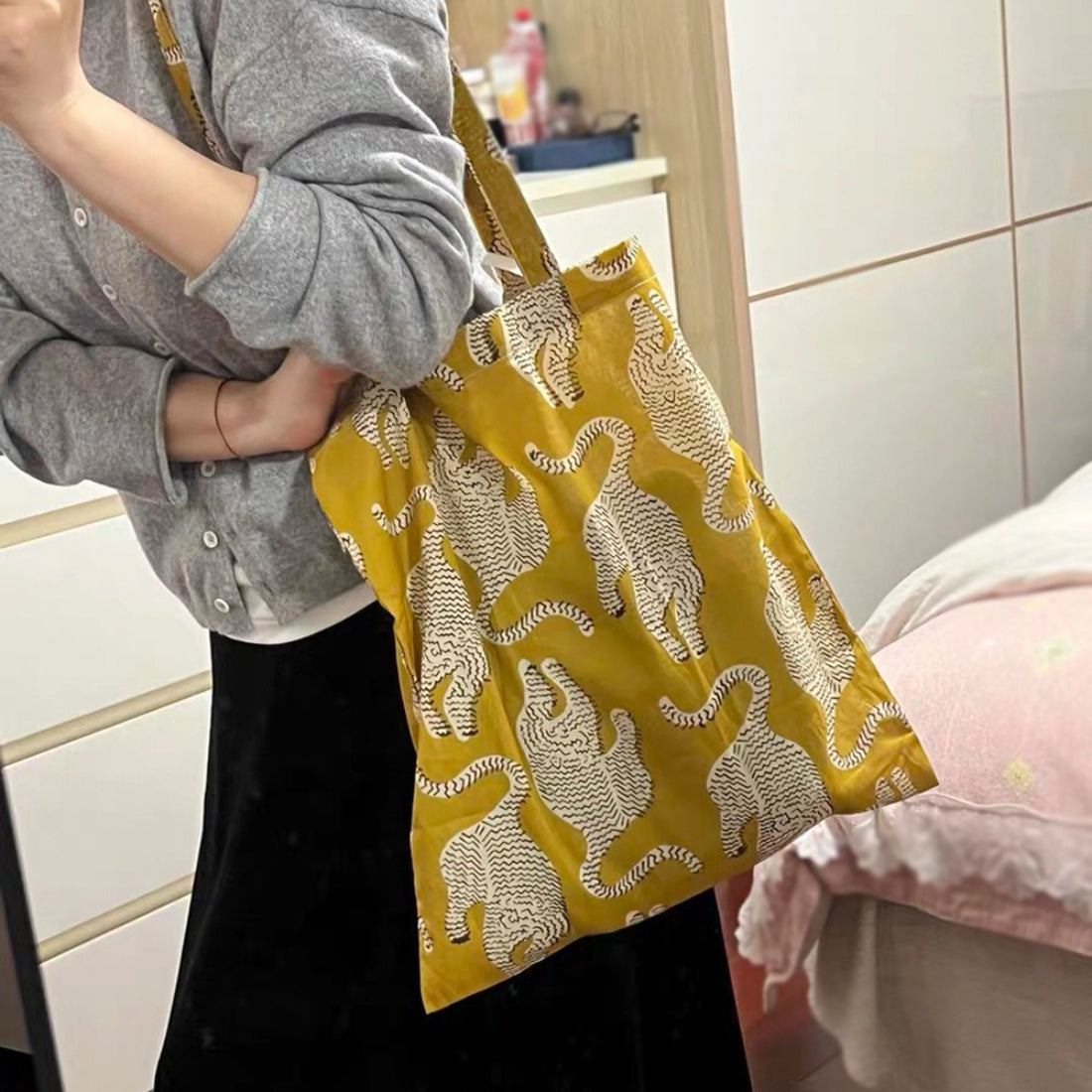 Close-up of Cosbai tote bag showing detailed animal and floral patterns