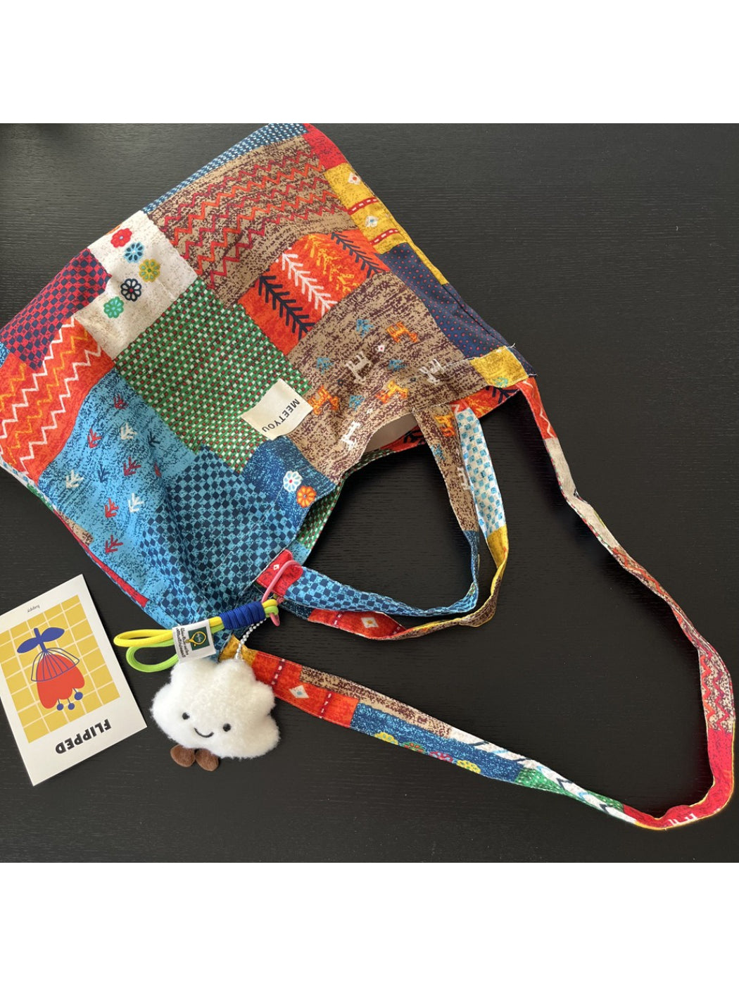 Cosbai tote bag with patchwork design displayed on white background, showing front view