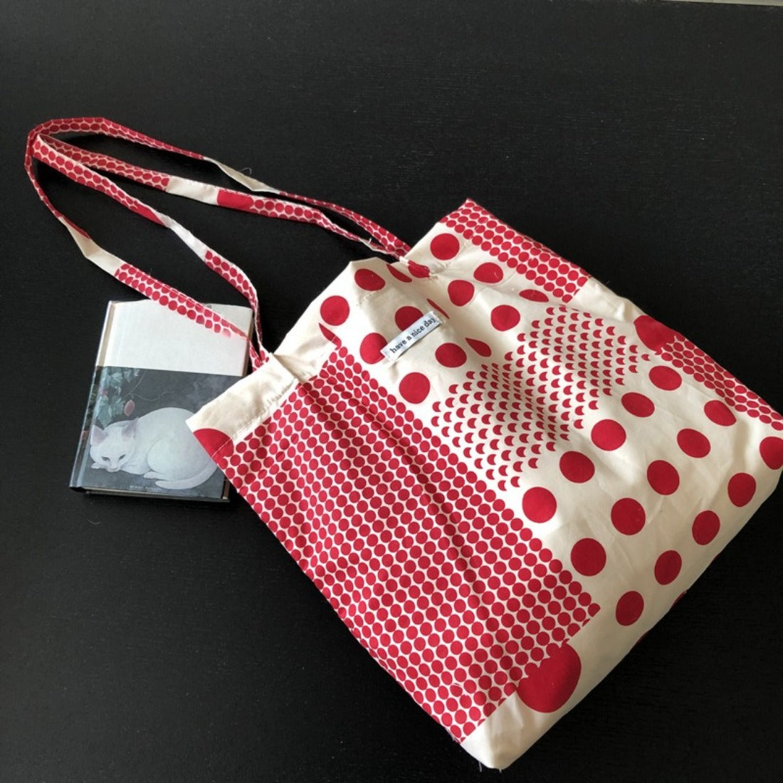 Cosbai Graphic Polka Dot Shopper Tote front view with black and white polka dot pattern