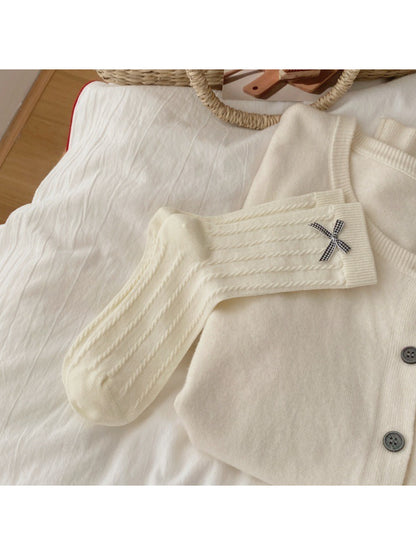 Close-up of black bow trim on white Rufia Classic Bow Trim Crew Socks