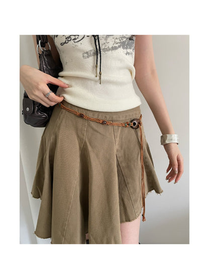 Slim beaded tie waist belt tied in a bow on a white surface