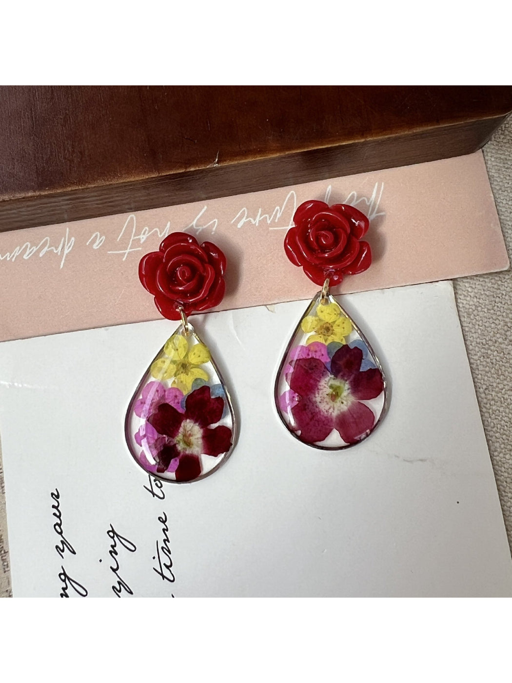 Side view of Earwish Rose Teardrop Earrings showing teardrop shape and clasp