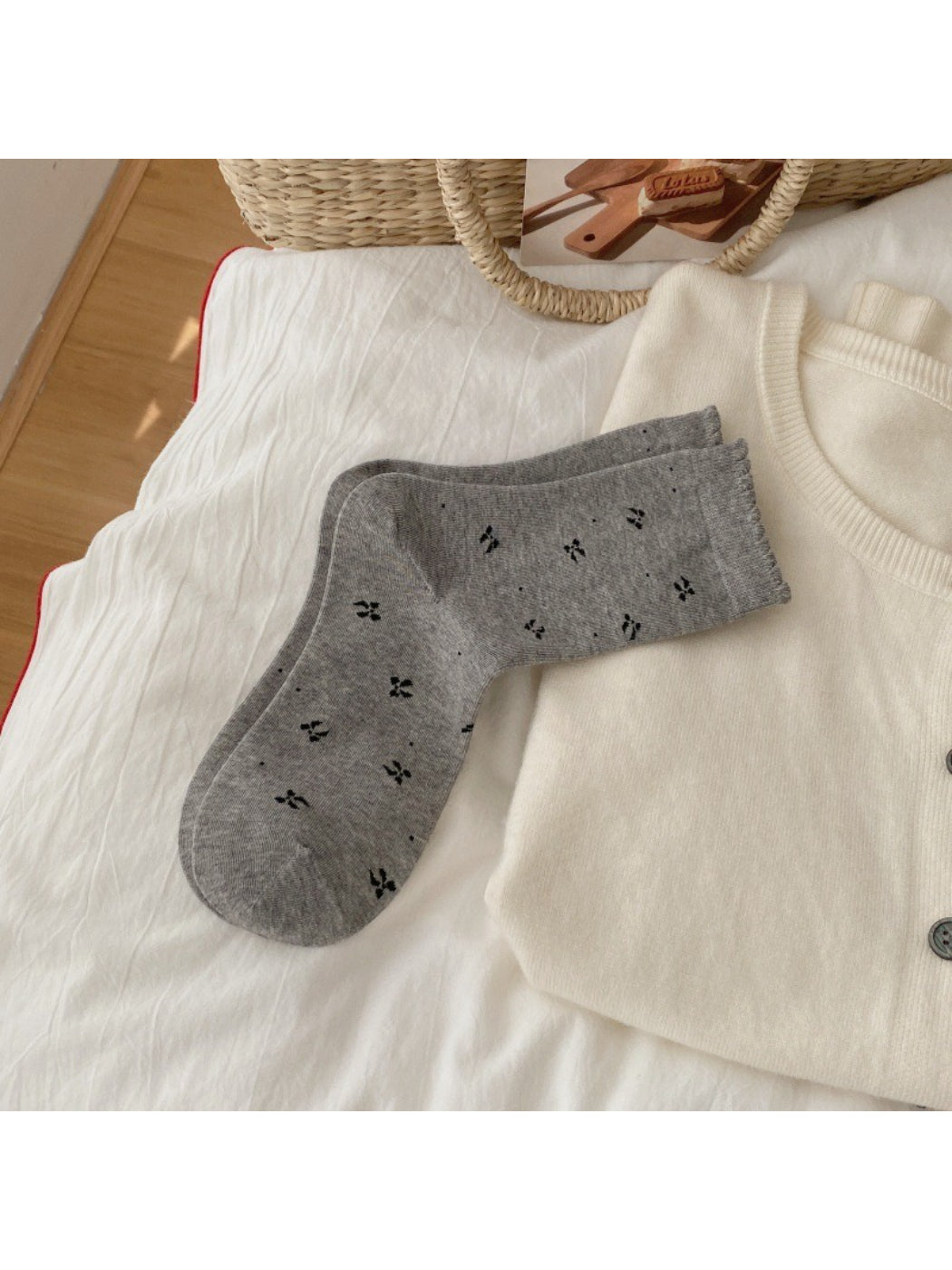 Model wearing Rufia soft bow motif crew socks with casual shoes