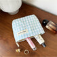 Cosbai pastel check zip pouch angled to show zipper and check pattern