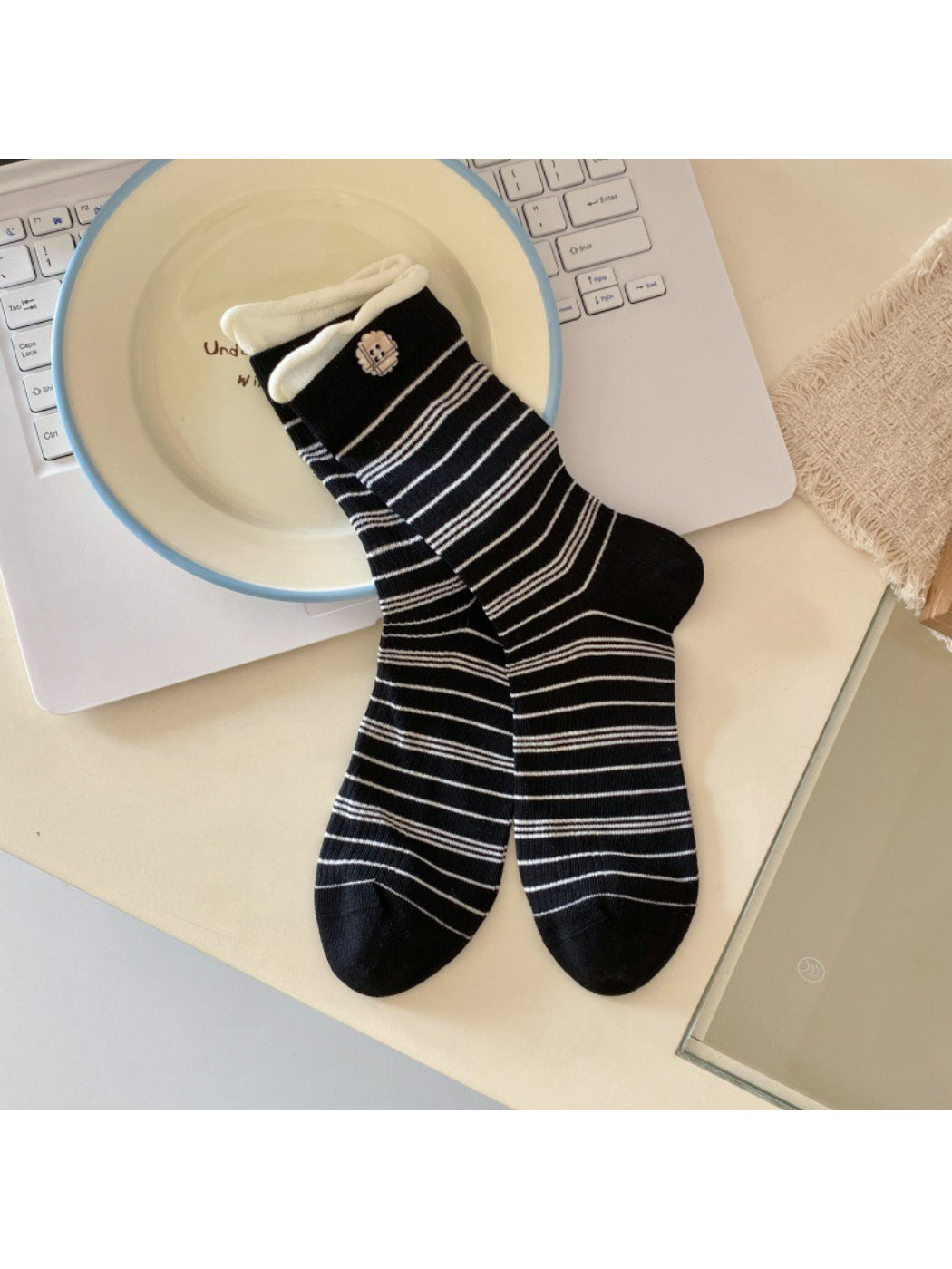 Model wearing Rufia ribbed socks with button detail and casual shoes