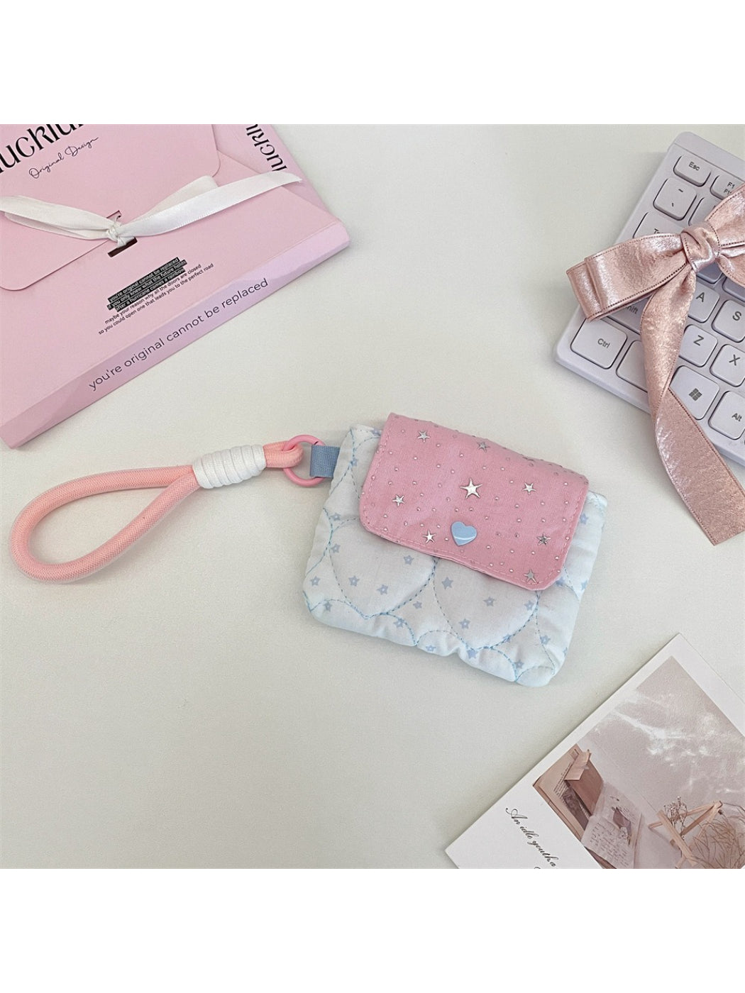 Side view of Cosbai quilted star mini wrist pouch highlighting thickness
