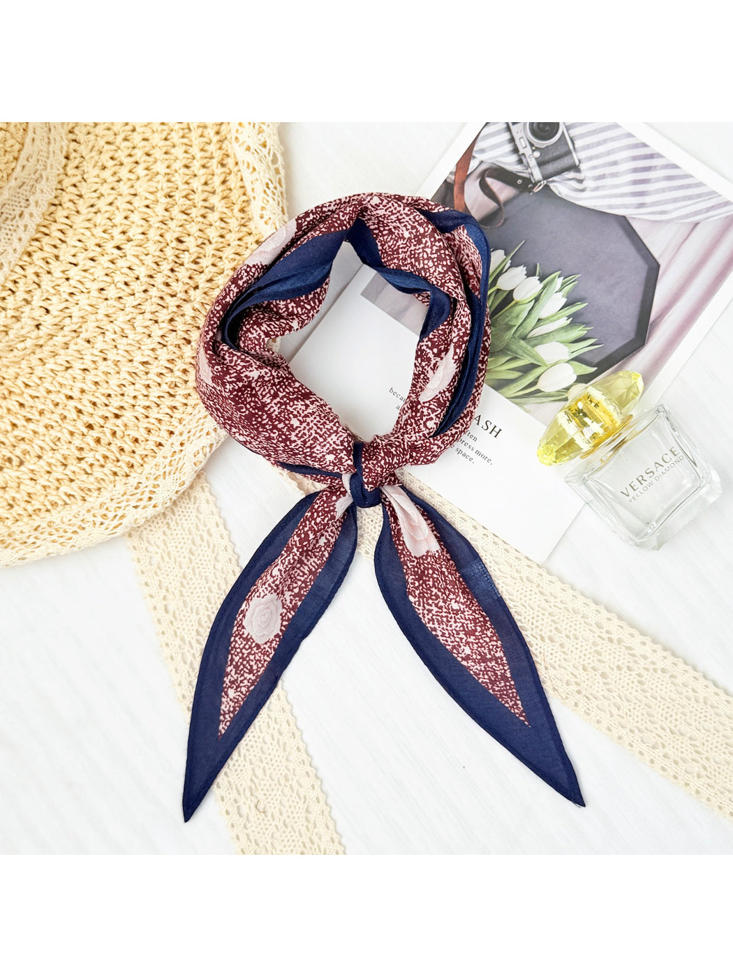 Model wearing mini rose triangle scarf tied around the neck
