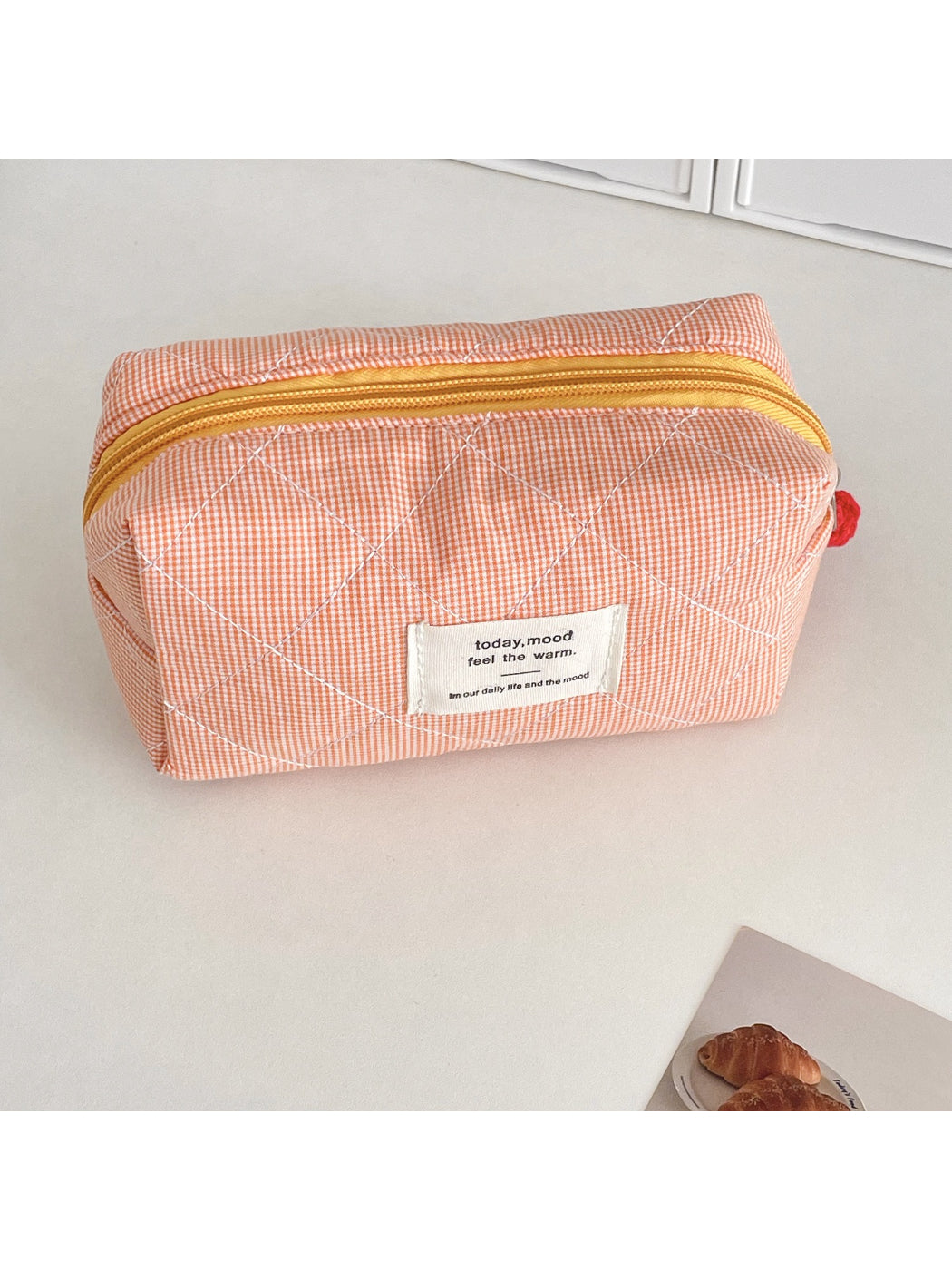 Cosbai cosmetic pouch folded flat showing flexible quilted material