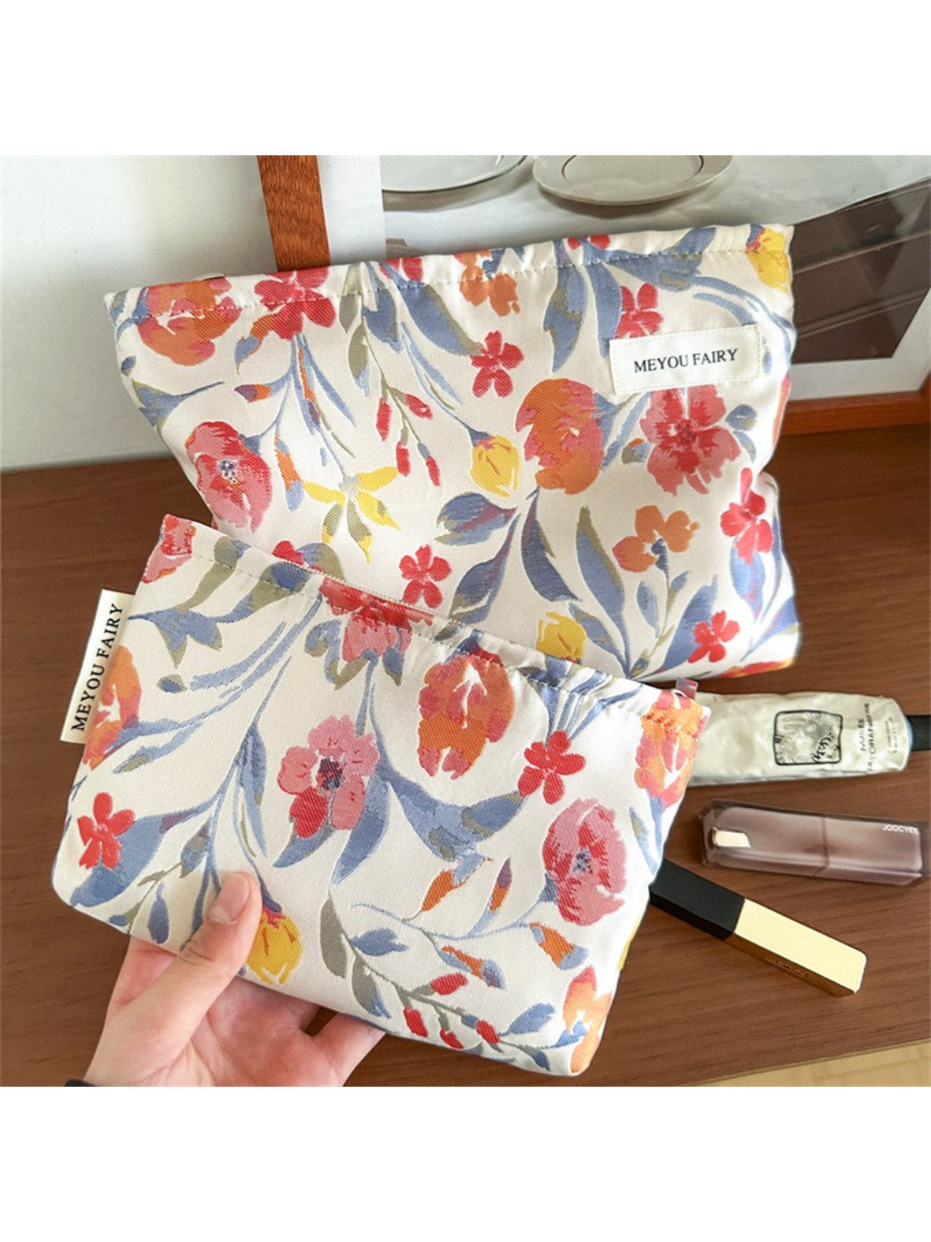 Close-up of Cosbai floral cosmetic pouch and fabric texture