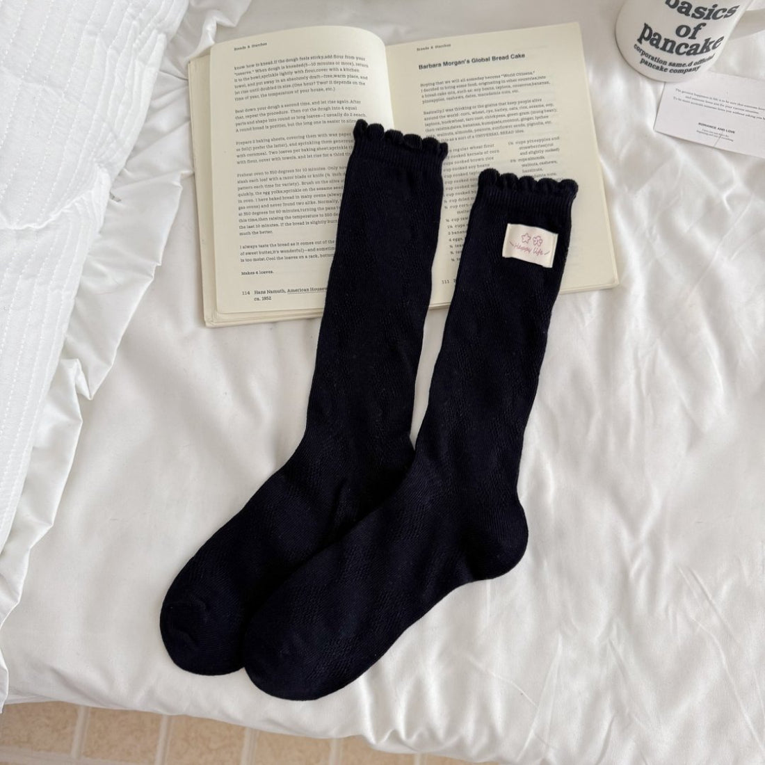 Side view of Rufia Fine Stripe Charm Crew Socks displaying the stripe detail and heel