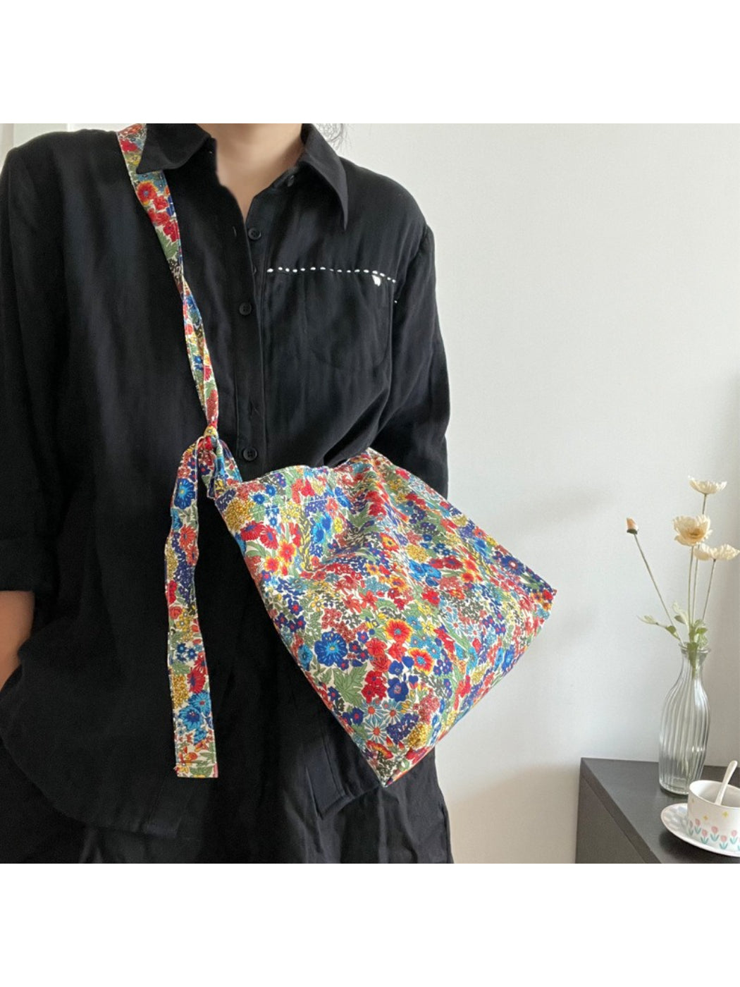 Cosbai Wildflower Print Shoulder Bag resting on wooden surface with lighting