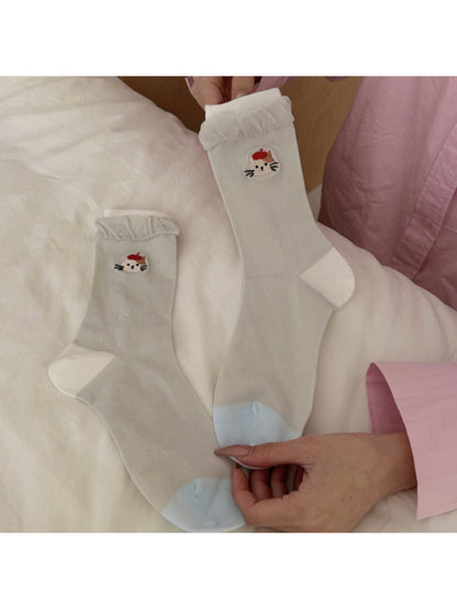Pair of white everyday socks with twisted cuff and black cat face detail