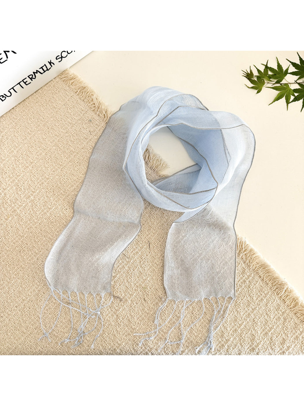 Sheer solid summer scarf styled as a head wrap on a model with casual outfit