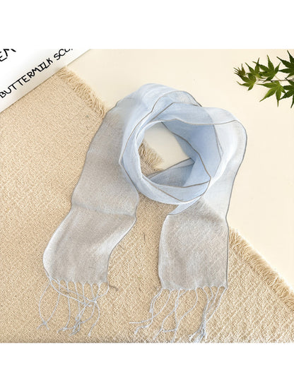 Sheer solid summer scarf styled as a head wrap on a model with casual outfit