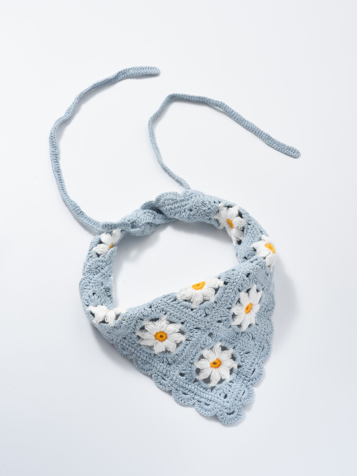 Scarvii crochet daisy smile hairband with visible crochet texture and smiley face