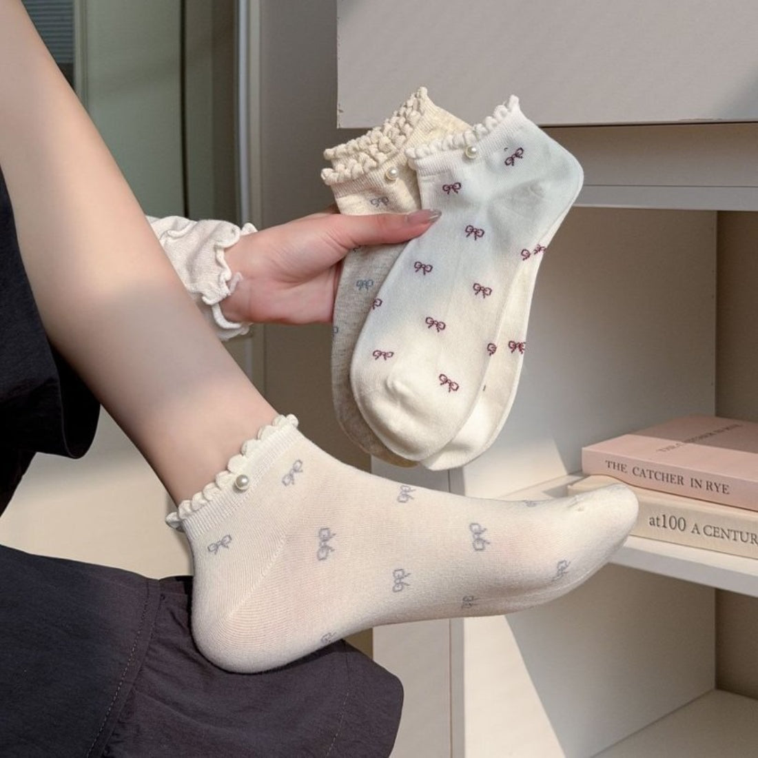 Pair of Rufia bow motif no show socks in light beige color displayed flat