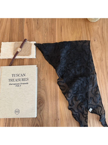 Folded sheer rosette triangle scarf displaying intricate rosette details and light, airy material