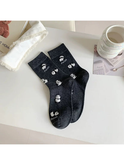 Rufia Playful Panda crew socks worn on feet showing full panda design
