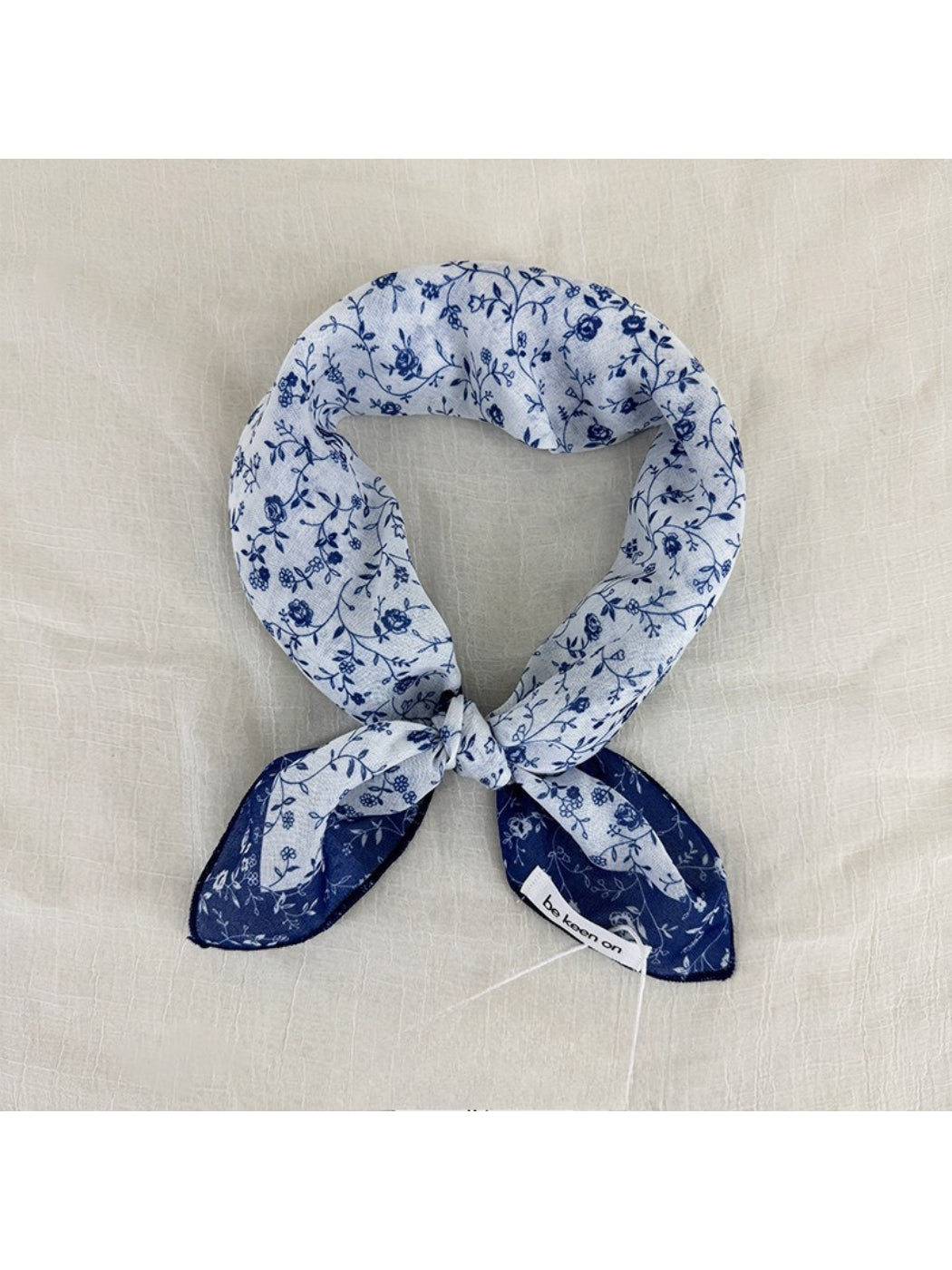 Scarvii Vintage Botanical square scarf folded to show floral print and soft fabric texture