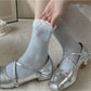 Rufia Pale Bow Everyday Socks shown from top down perspective