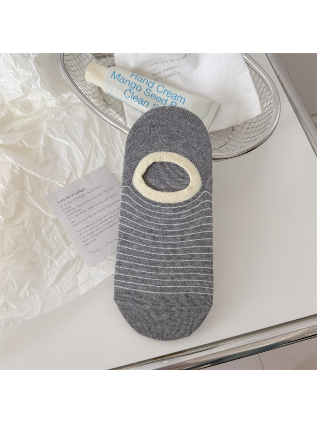 Rufia striped low cut liner socks worn with casual outfit, visible ankle and stripe design