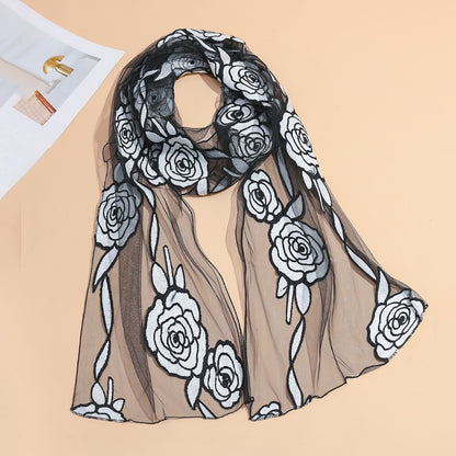 Sheer rose mesh scarf draped over a white mannequin bust