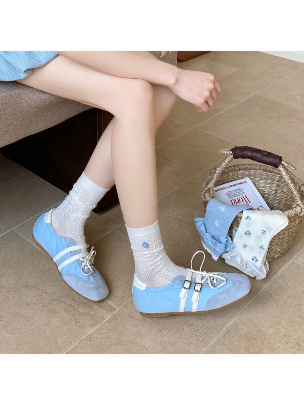 Rufia socks displayed with packaging featuring floral and stripe theme