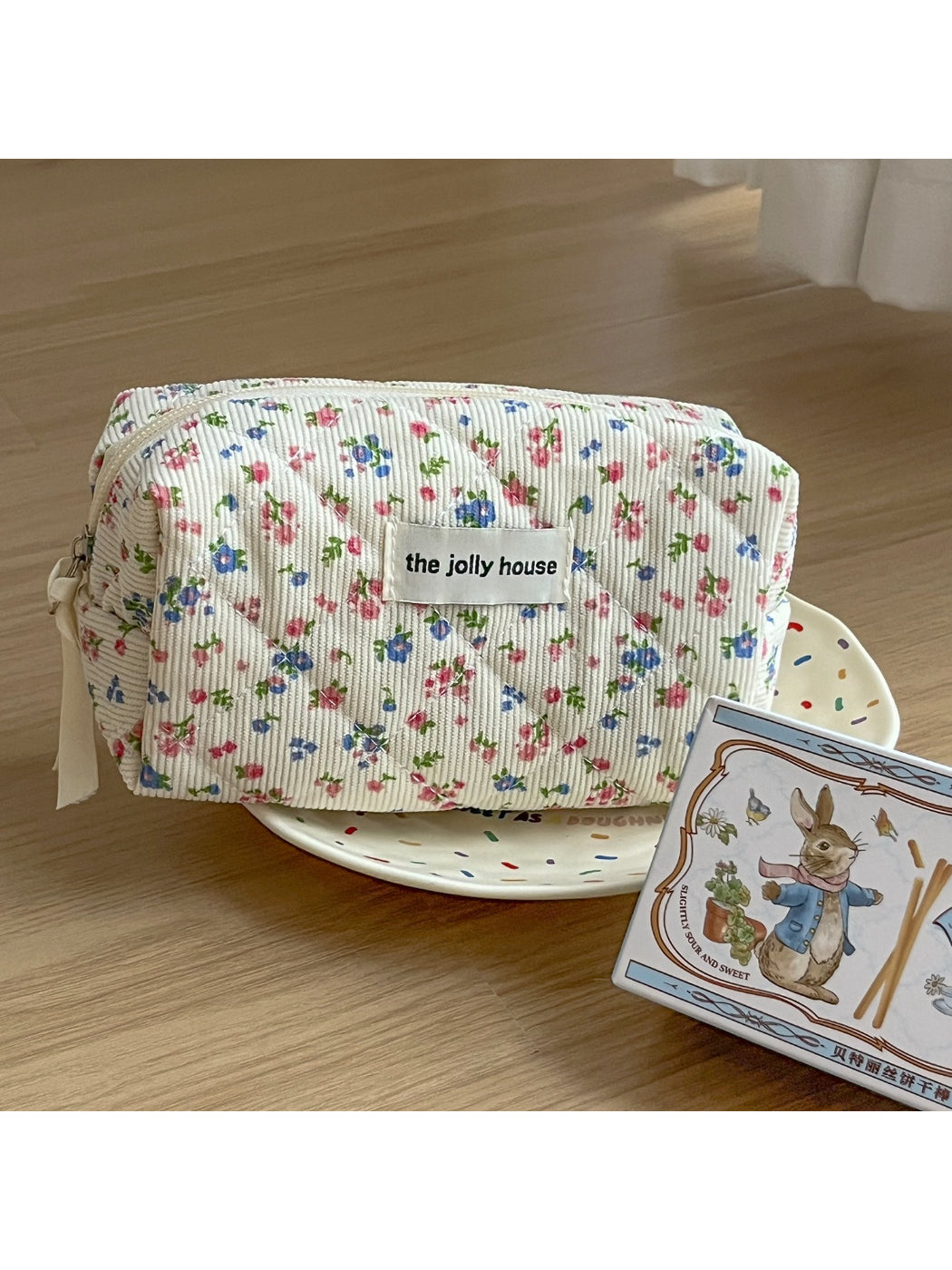 Side view of Cosbai soft corduroy floral toiletry bag highlighting and stitching details