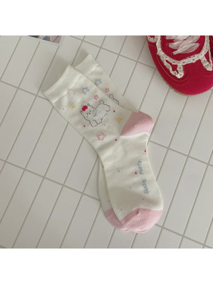 Rufia dog mid-calf socks displayed with one sock rolled down to show length