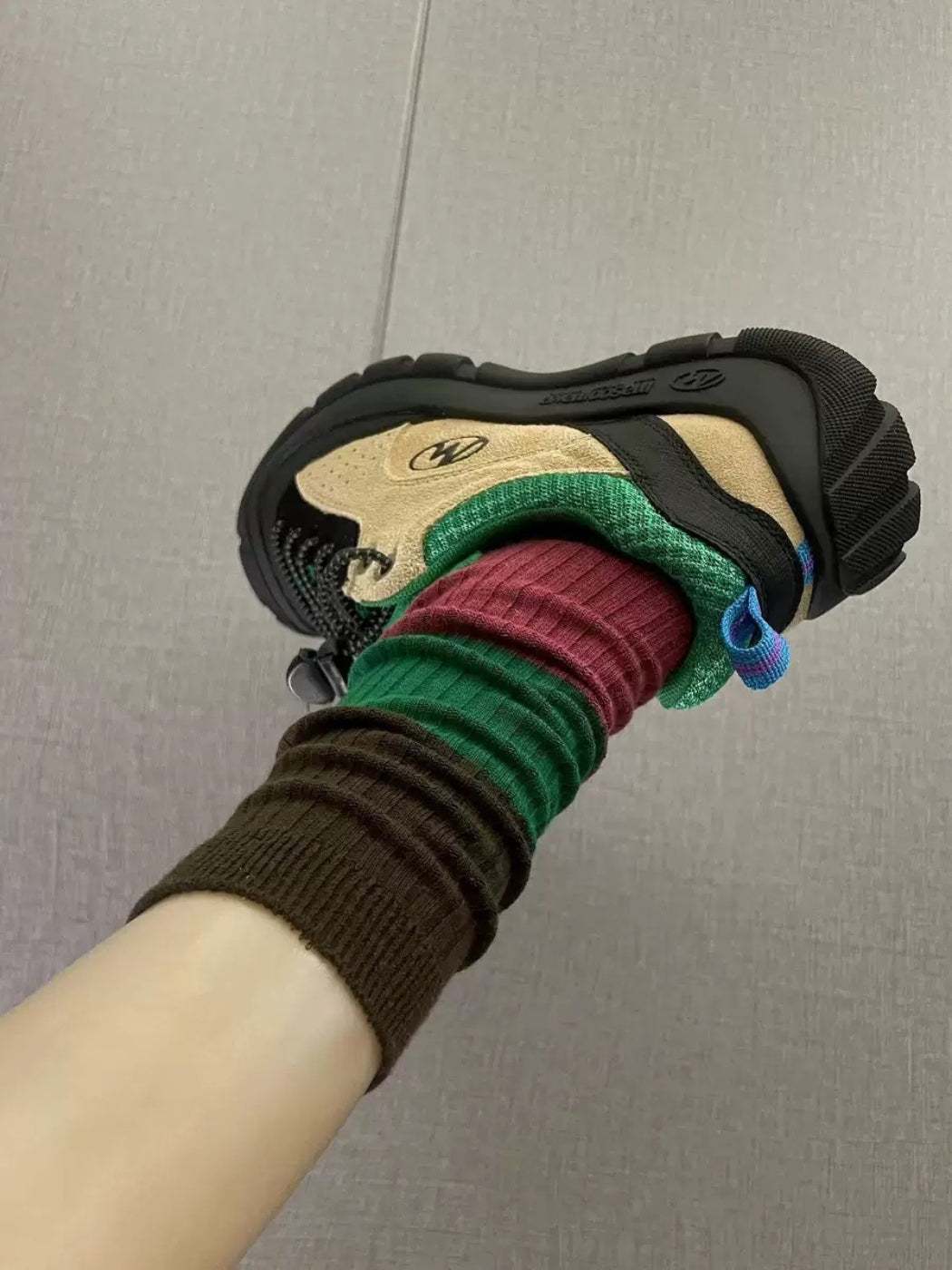 Rufia ribbed crew socks folded to display colorblock pattern and ribbed knit detail