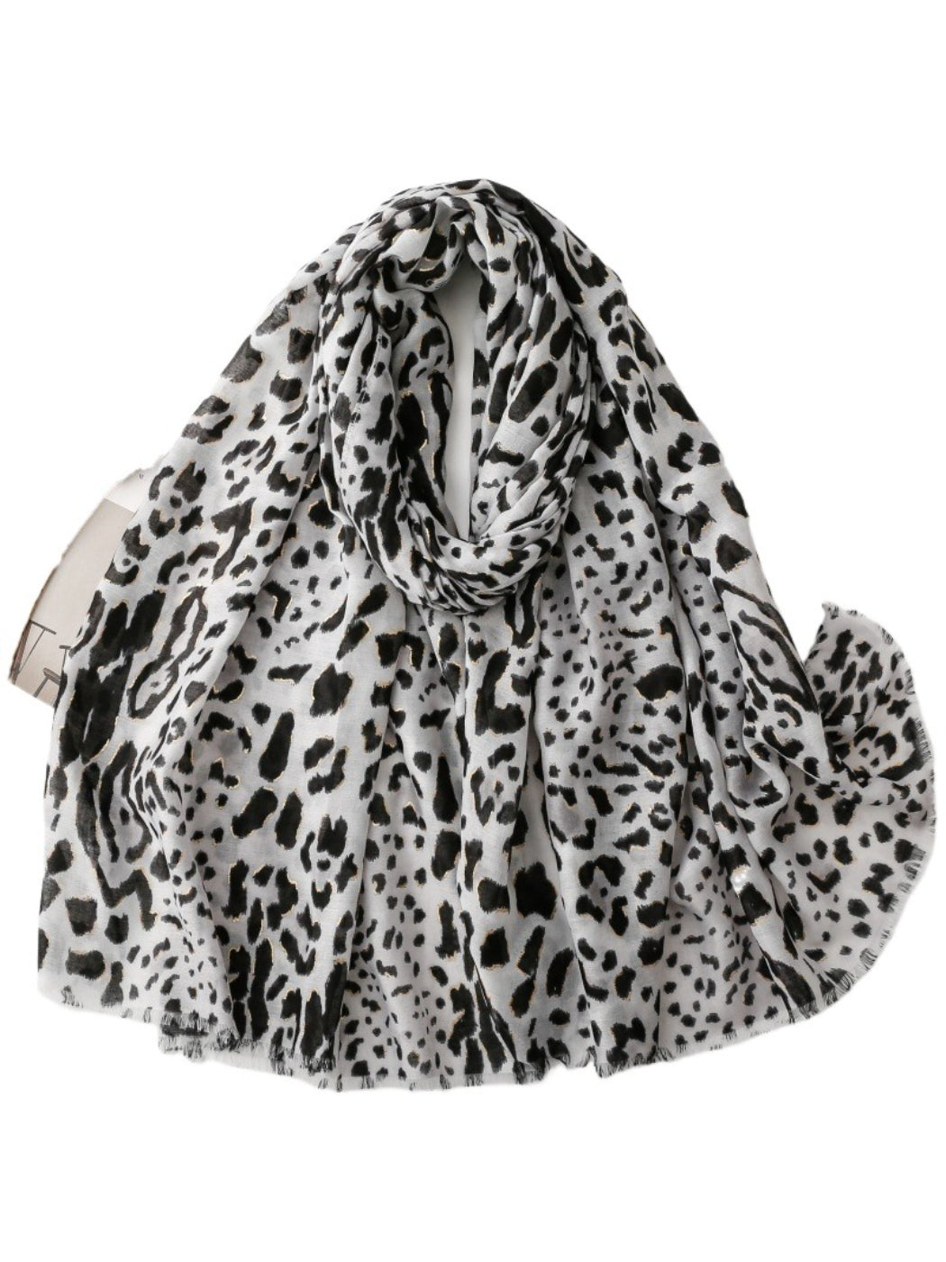 Snow leopard print scarf folded on a white background