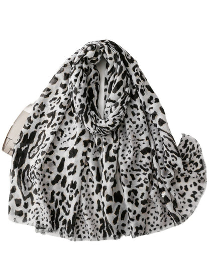 Snow leopard print scarf folded on a white background
