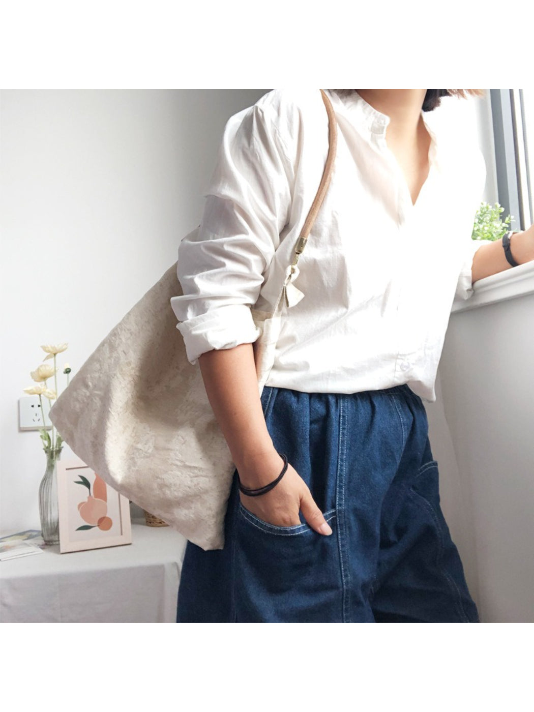 Ivory hobo bag showing shoulder strap and