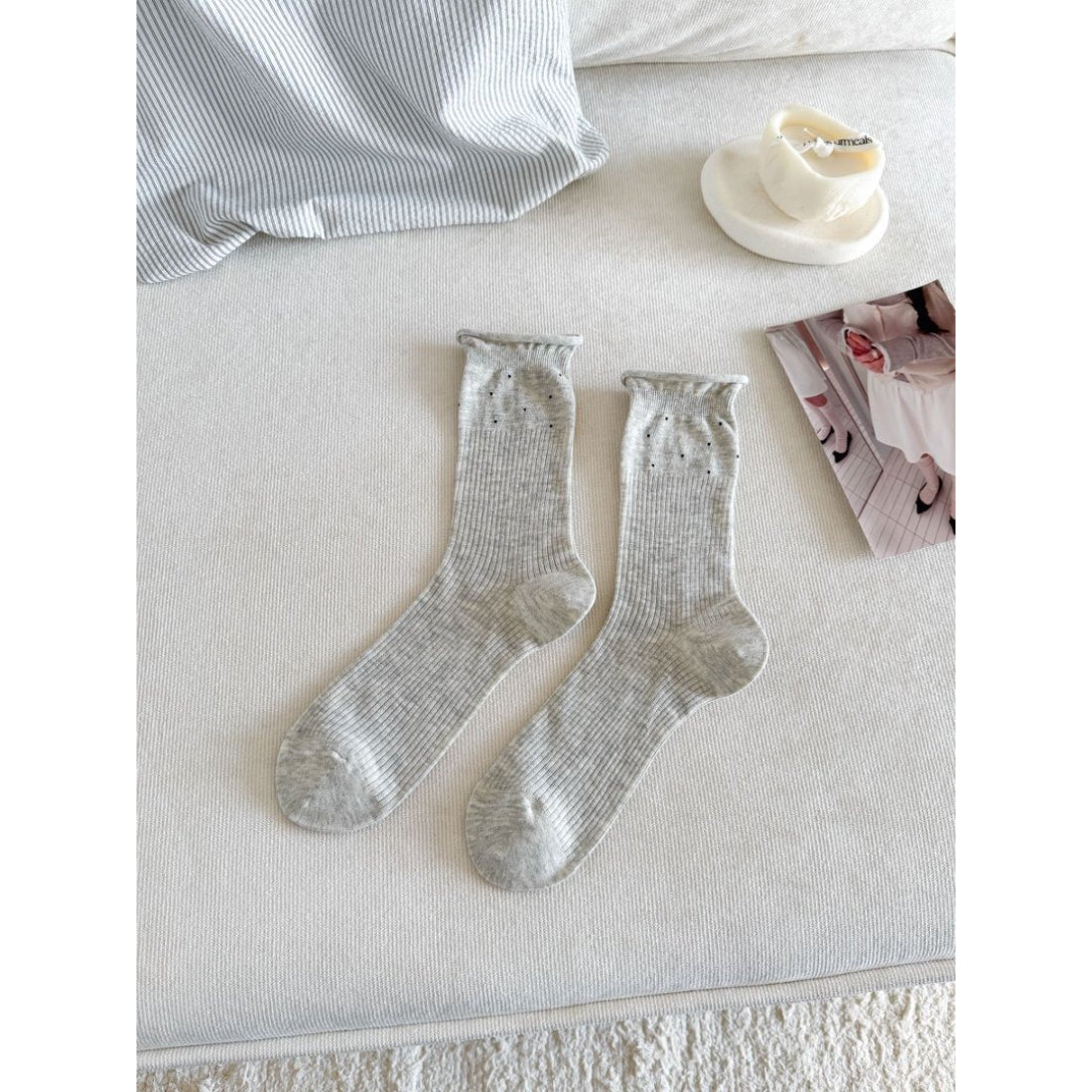 Top view of beige Rufia Everyday socks highlighting the cuff and knit design