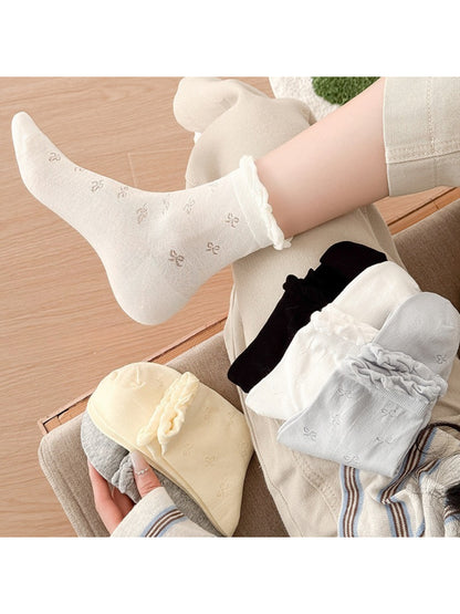 Rufia Sweet Bow Knit Crew Socks in soft pink with bow detail on ankle