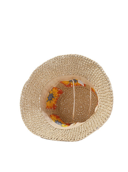 Haila bucket hat folded to show texture and flower patch detail