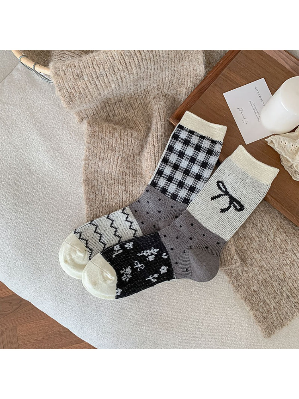 Side view of Rufia crew socks highlighting bow accent and knit texture