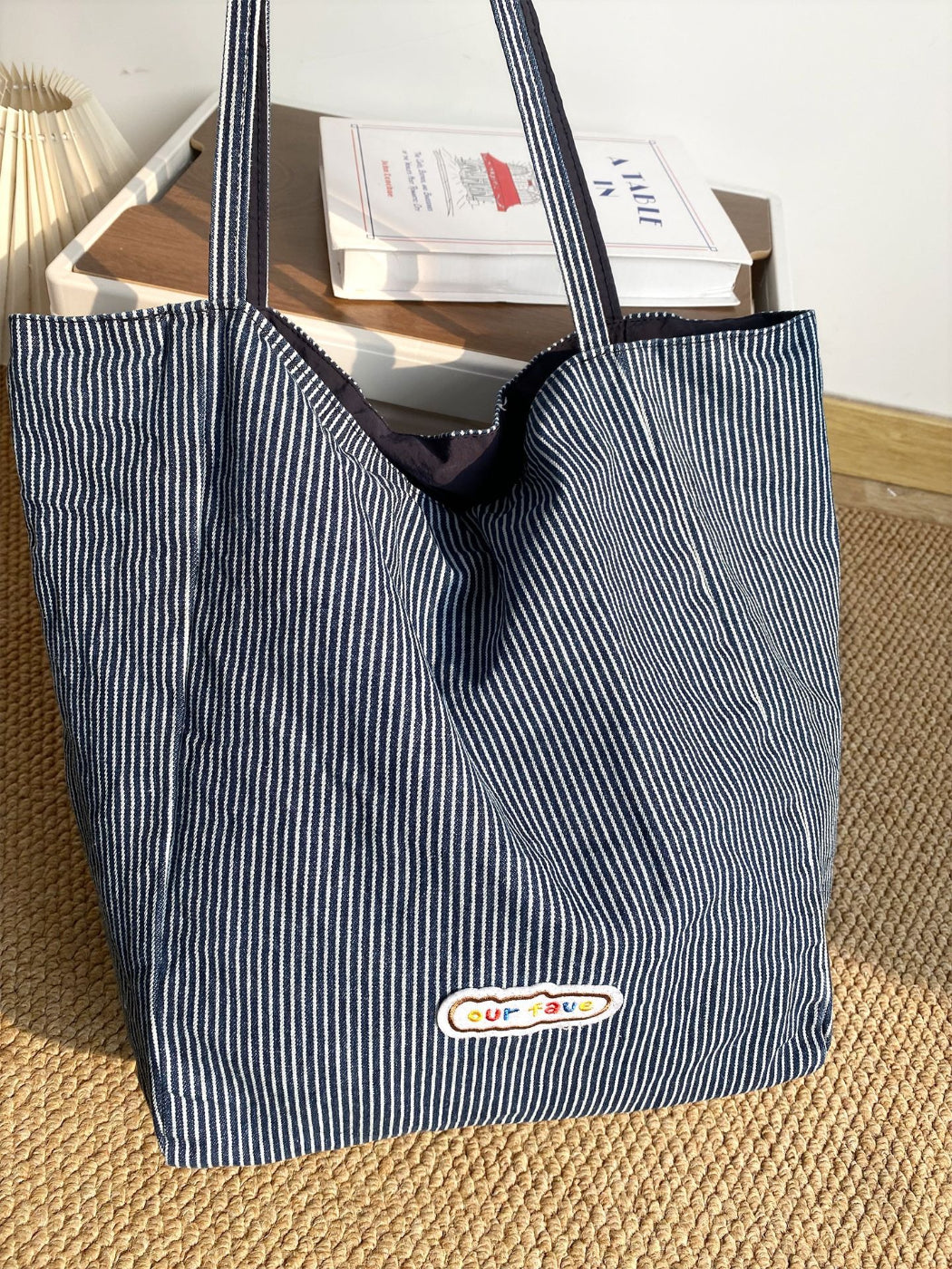 Cosbai tote bag held by model showcasing size and handle length