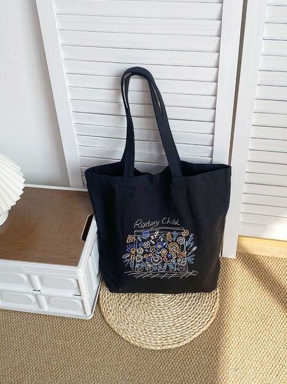 Cosbai tote bag held by model, displaying floral artwork